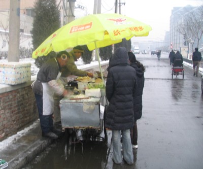 These guys serve up snacks for breakfest for people on their way to work