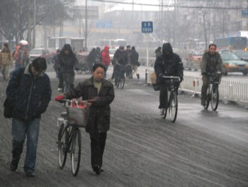 People still have to go to work - but in the snow - on their bicycles