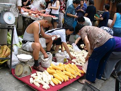 Guy sells corn on the street in Beijing
