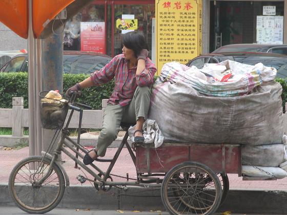 This lady collects plastic bottles, boxes and anything else that can be recycled - in Beijing
